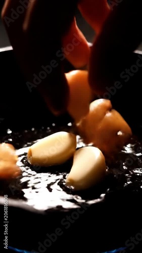 Close-up of cheese slice on dark surface with droplets
