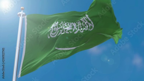 Saudi Arabia National Flag Waving in the Wind Against Sunny Blue Sky