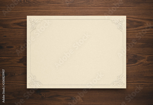 Blank certificate template on dark wooden background with elegant lace border