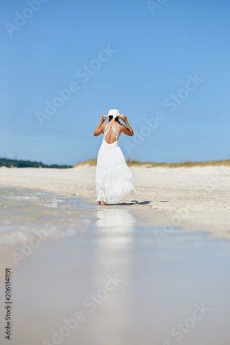 Young Girl Standing in Shallow Seawater