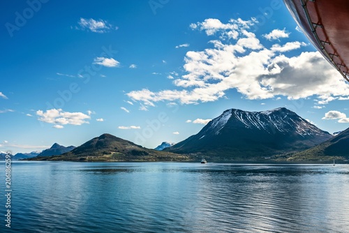 Landscape in Norway with a boat, seen from a ship