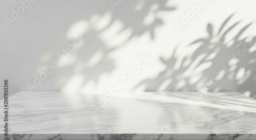 White marble surface with soft leafy tree shadows.