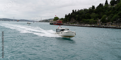 Modern motorboat speeding through the Bosphorus strait in Istanbul with copy space