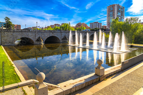 Madrid, Spain. Historic Segovia Bridge over Manzanares river in Madrid view.