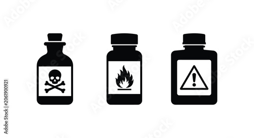 Foto Three chemical bottles with hazard symbols in black silhouette bottle glass cont