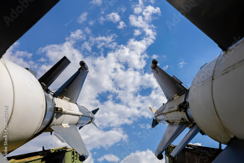 Foto Two missiles aiming skyward showing military power and threat