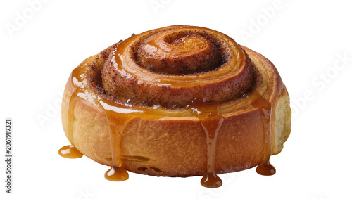 Fotografía Fluffy cinnamon roll with caramel glaze dripping down, isolated on transparent b