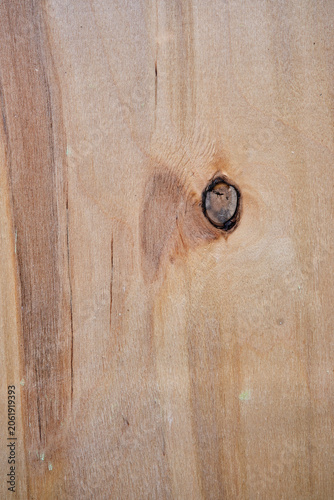 Macro view of old weathered wood surface featuring natural fiber grains, split lines, and small splinters peeling off. Grungy rustic timber board panel background 