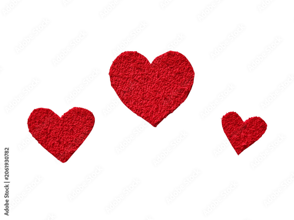 Obraz premium Three textured red felt fabric heart shapes in different sizes on a transparent background