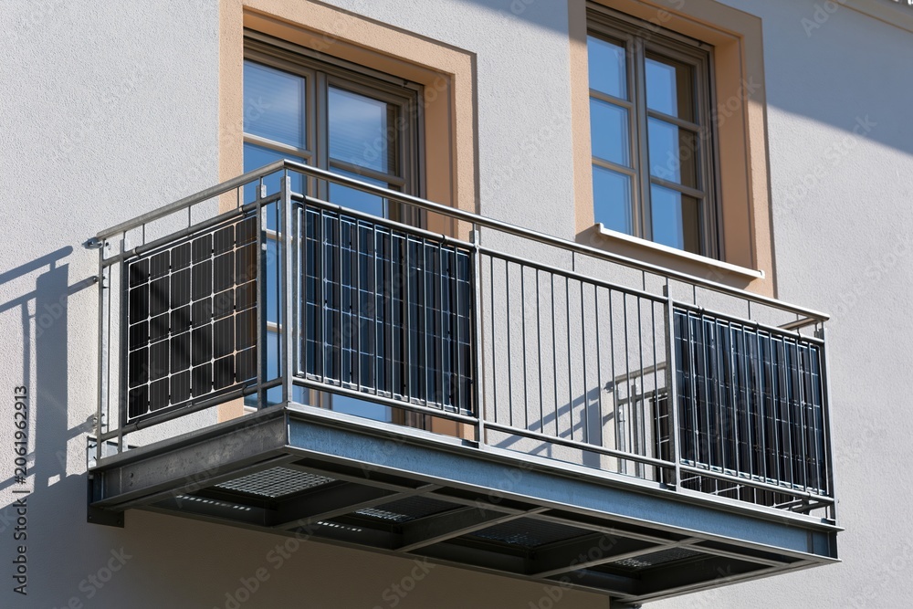 Obraz premium Modern apartment balcony with railings and sunlight