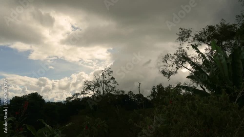 Gathering of stormy clouds over the farms and forest