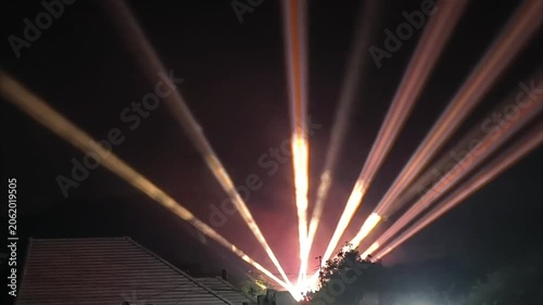 Spectacular Laser Light Show Illuminates the Night Sky with Vibrant Beams.