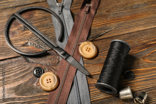 Konstfotografi Different tailors supplies on brown wooden background