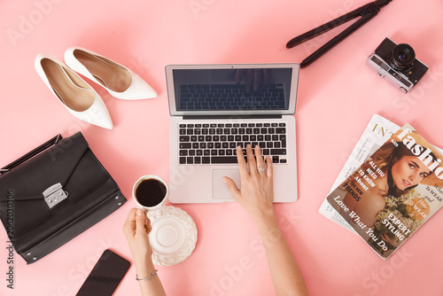 Female hands using laptop w...