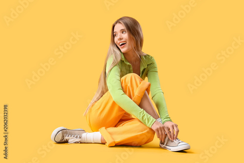 Stylish young woman in snea...
