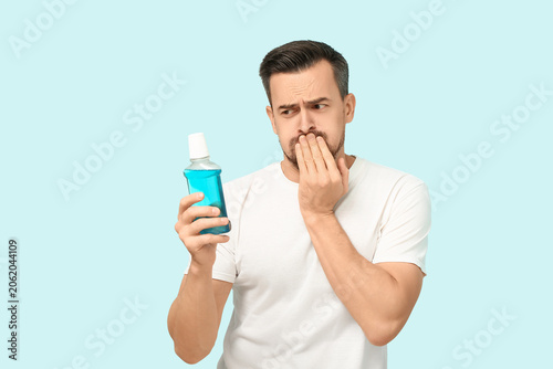 Upset young man with mouth ...