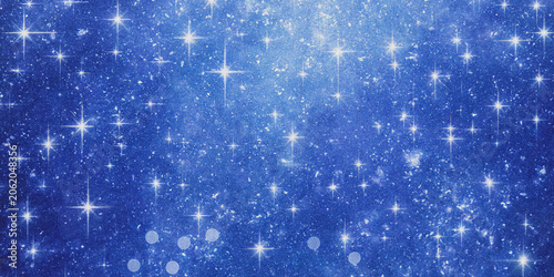 Foto Blue starry sky background with scattered sparkling lights and bokeh effects