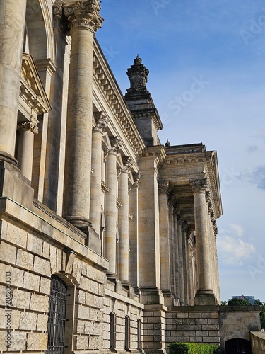 Classical stone building with tall columns, ornate capitals and detailed facade