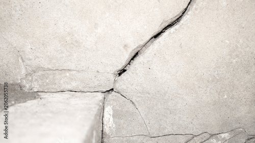 Cracked Concrete Surface with Detailed Texture and Gray Tones