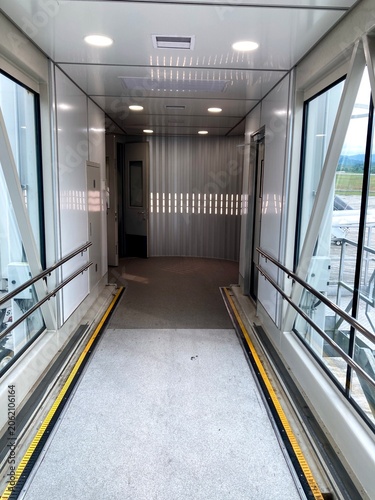 empty interior of an airport jet bridge or passenger boarding bridge