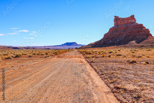 Unpaved Valley of the Gods Road Dirt Road Winding Through Valley of the Gods in the Utah Desert.