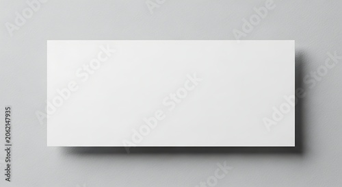 Minimalist White Blank Signboard on Gray Wall for Advertising or Branding.
