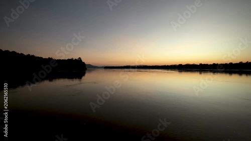 Peaceful twilight reflection on Mekong River landscape