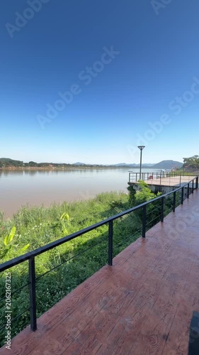 Panning shot of river boardwalk and peaceful landscape