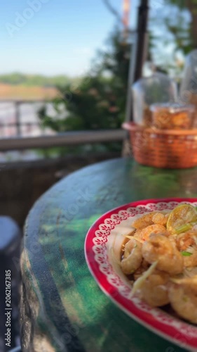 Authentic Thai spicy papaya salad with crispy pork cracklings