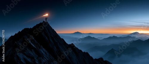 Person Standing on Mountain Holding Torch at Sunrise in Nature