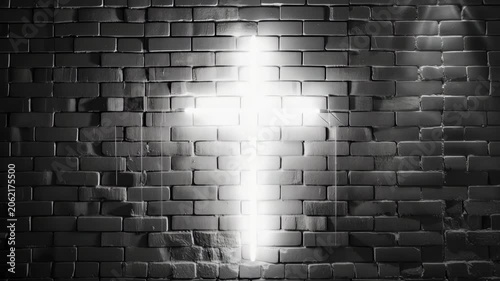 Light shines from a cross on a brick wall in a dark setting at a church or place of worship during evening hours
