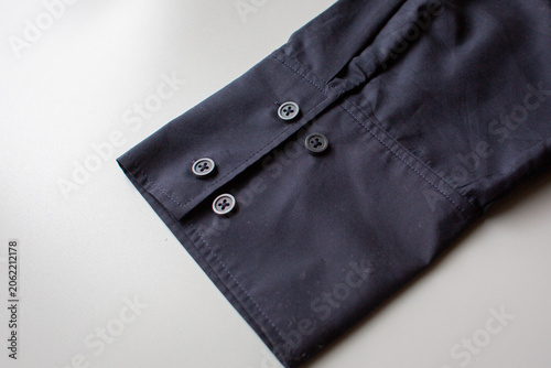 Close up of shirt cuff with buttons