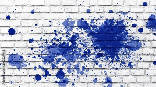 Vibrant blue liquid splatter covers a textured white brick wall surface.