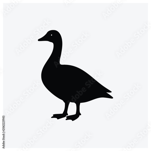 A black silhouette of a swan standing on a plain background.