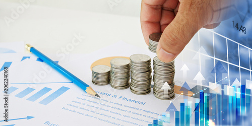 businessman Stacking Coins with Growth Chart. Business Strategy Development and Growing Growth Plan concept.