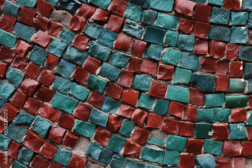 Mosaic tiles shimmer with earthy tones