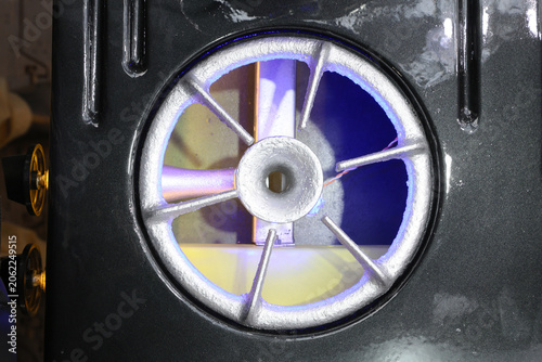 Metal wheel spins inside dark machine housing