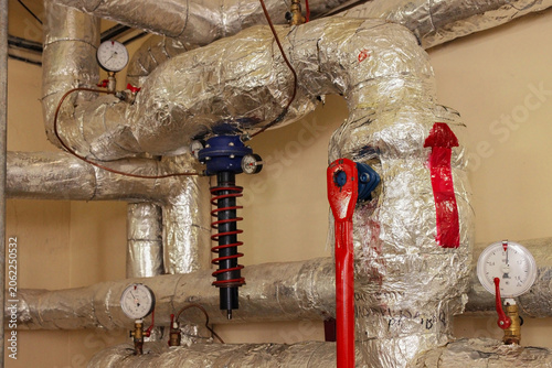 There are two gauges on the pipe, one of which is showing a higher reading than the other