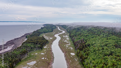 Low Fog Over Coastal Wetlands and Winding River Aerial View in Atlantic Canada