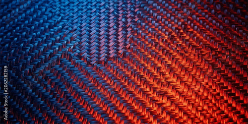Fotografie High resolution carbon fiber pattern with warm and cool lighting high tech backg