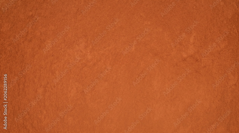 Fototapeta premium Red Clay Soil Texture Background with Rough Earth Surface and Natural Terracotta Dirt Ground