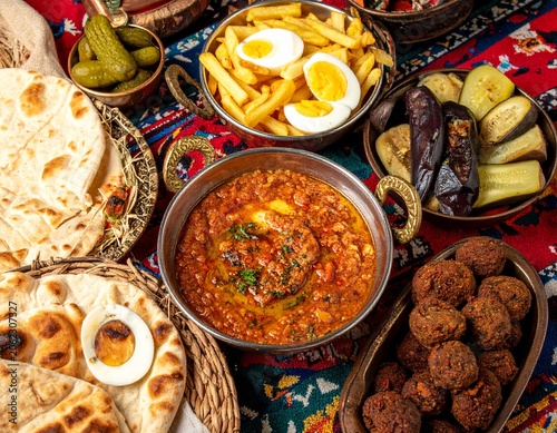 Traditional Middle Eastern Food Spread on Colorful Rug
