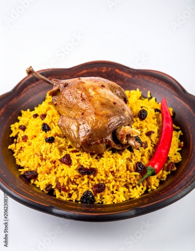 Roasted Lamb on Yellow Rice with Raisins and Chili