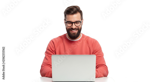 Smiling bearded man wearing glasses using a laptop computer isolated on transparent background