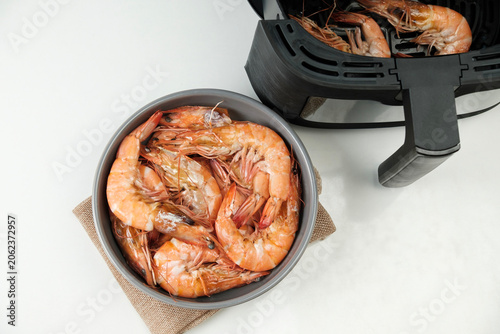 Photography Top view of Cooked orange Shrimp in a gray bowl.