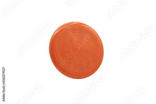 A bright orange plastic frisbee featuring concentric circular grooves on the surface isolated on a transparent background