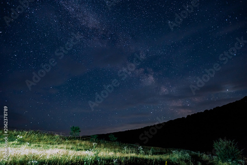 Quadro em tela Majestic night sky filled with countless stars sparkling brightly captured at a remote location under a clear moonless expanse