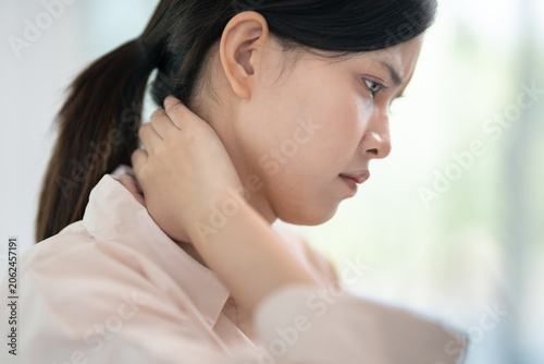 Bild auf Leinwand office syndromes, woman massaging neck pain due to work and using a computer, di
