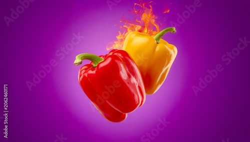 Bell peppers are captured with dramatic visible flames against a bold purple background in a vibrant barbecue braai-inspired food photography