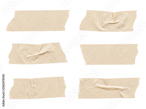 A set of six unique light brown masking tape pieces, characterized by distinct creases and torn edges.